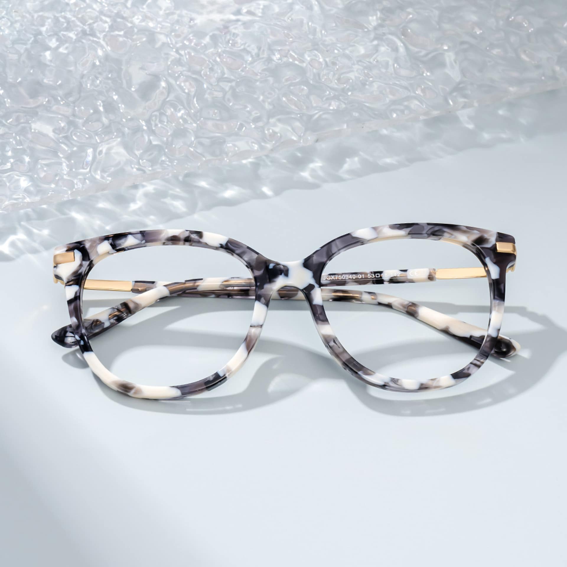 Round Grey Glasses With a Marble Pattern1