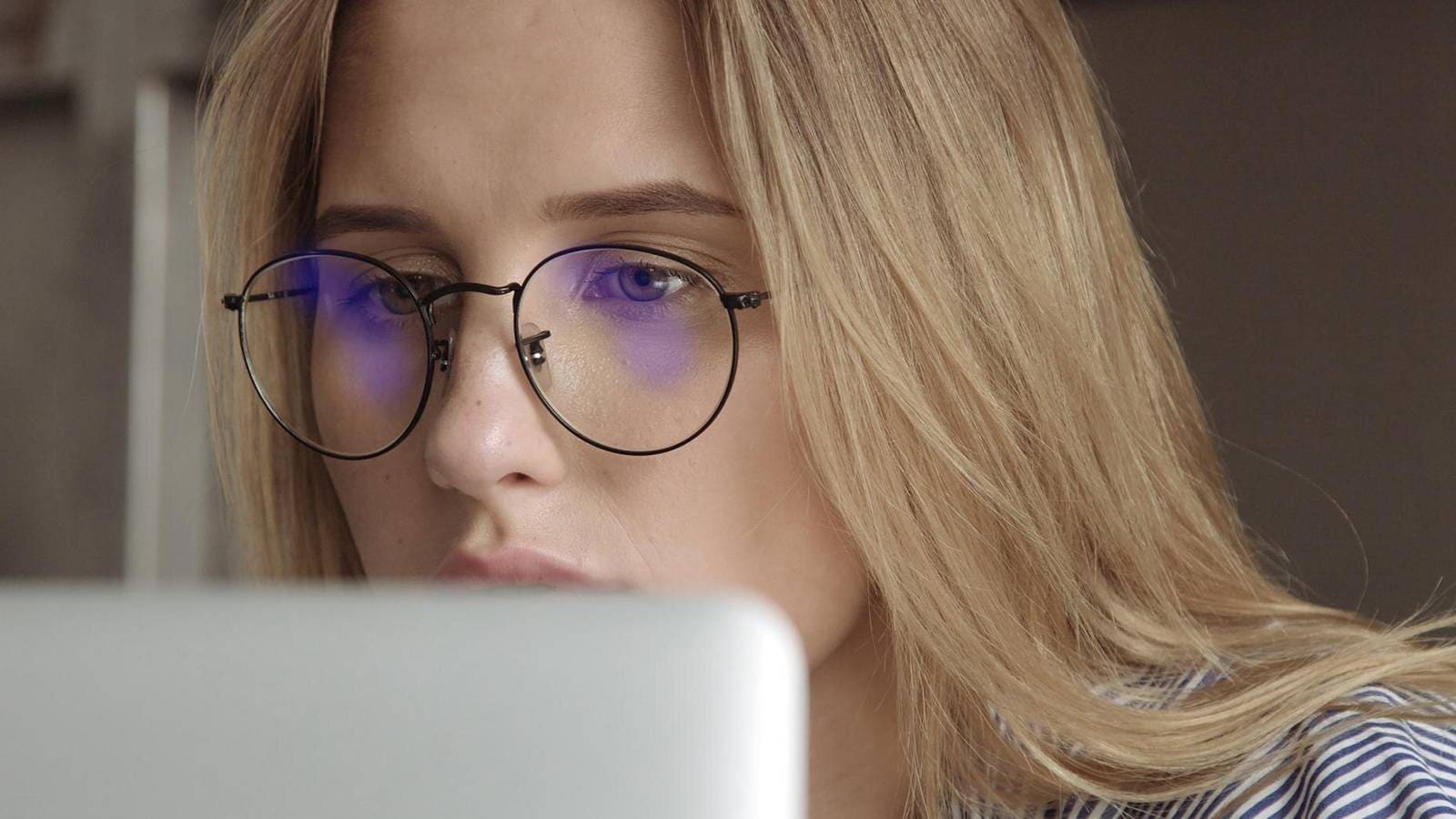 Close-up of clear glasses with blue light filter protecting eyes from digital screen strain.