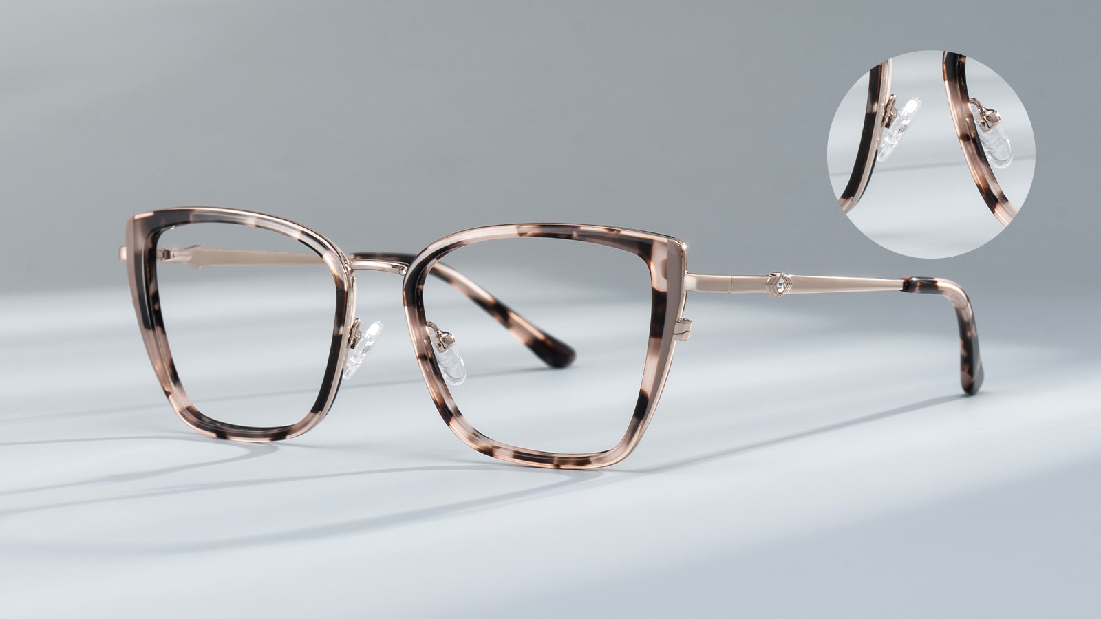 eyeglass frames with a closeup on the adjustable nose pads that help prevent fog.