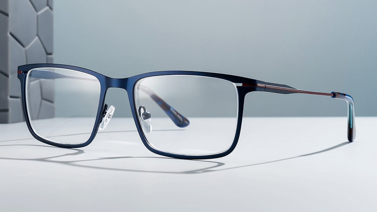 A pair of stylish blue rectangular glasses.