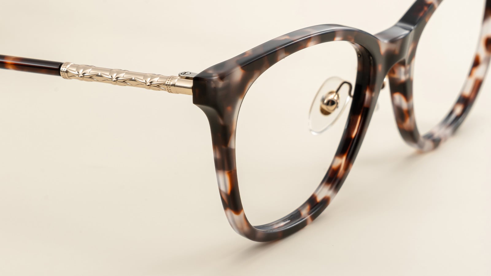 Anti-slip silicone nose pads and tools for low bridge glasses adjustment.