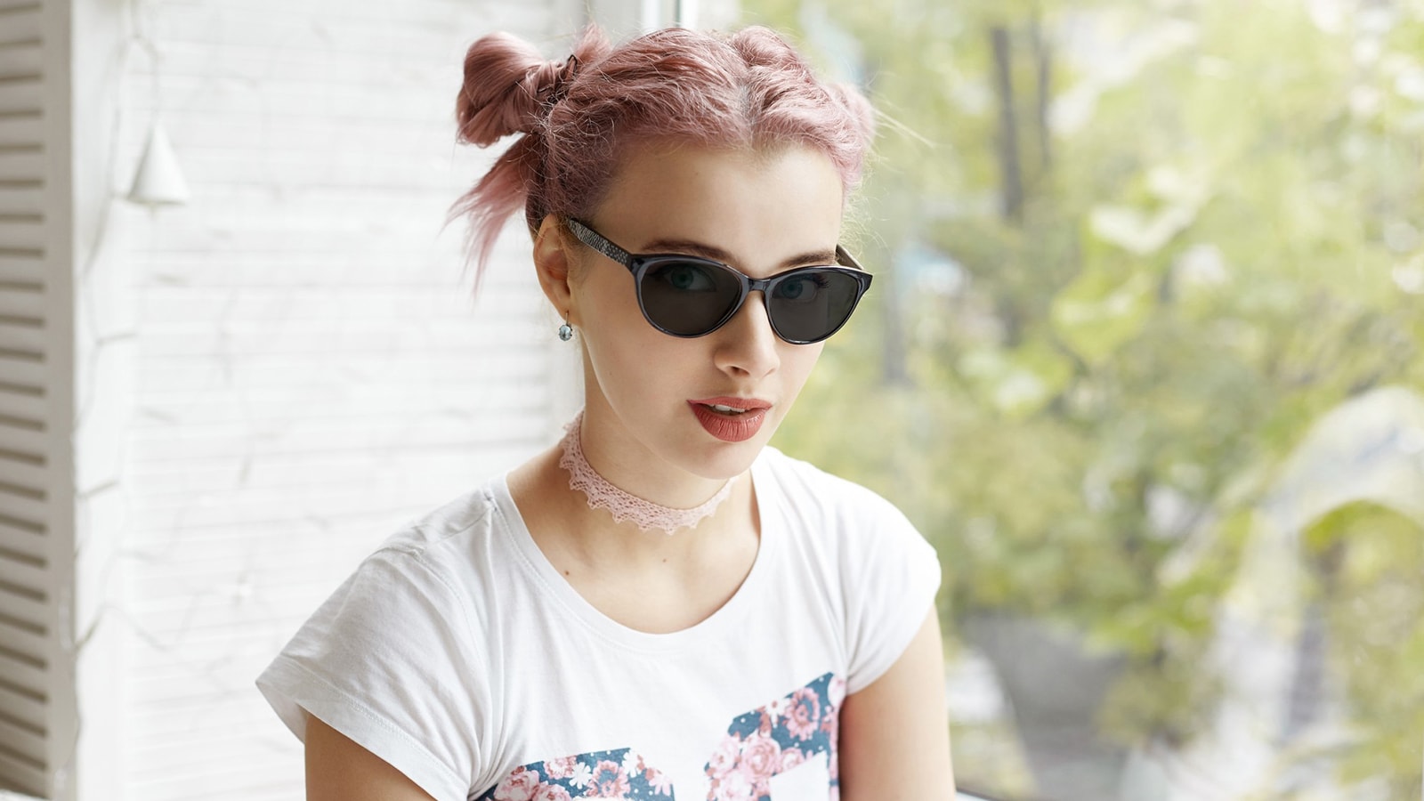 Woman wearing polarized sunglasses indoors for glare protection and style